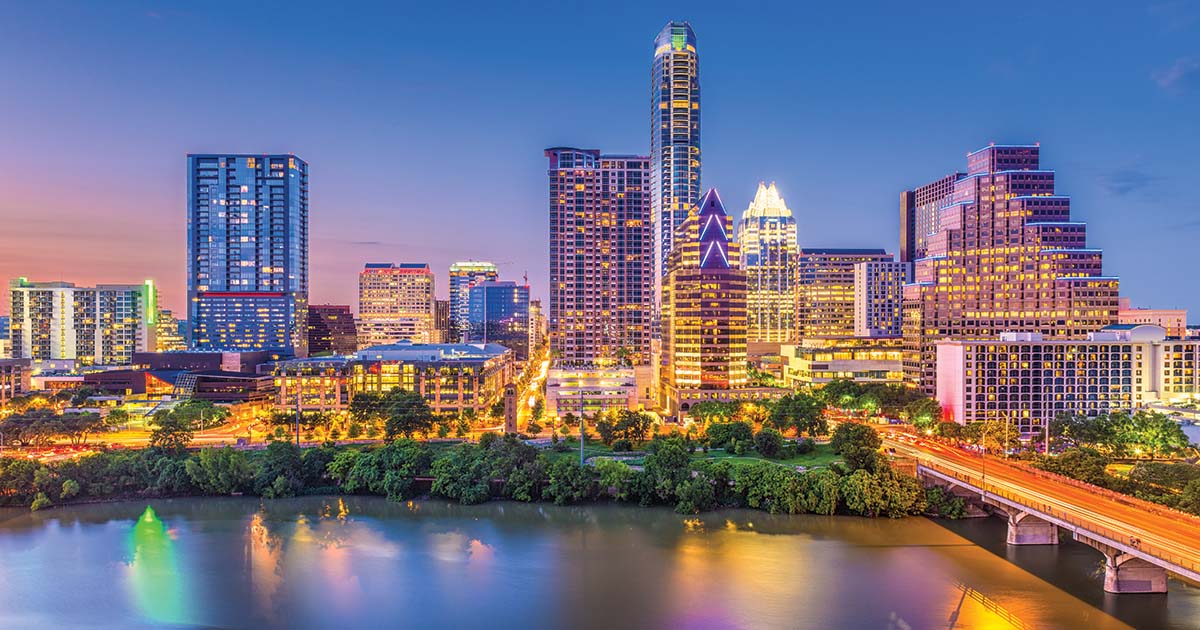 Nighttime photograph of the Austin, TX skyline, home of the best sports videographers at American Sports Memories