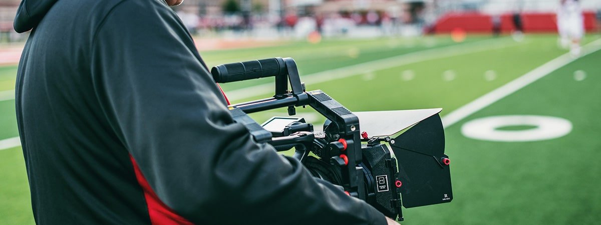 camera operator on football field
